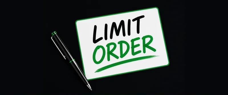 Trader pointing at a limit order resting on stock market charts across dual monitors